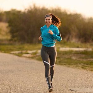 young-happy-sportswoman-running-road-morning-copy-space