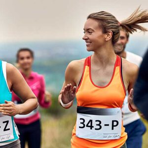 young-happy-sportswomen-participating-marathon-communicating-during-race